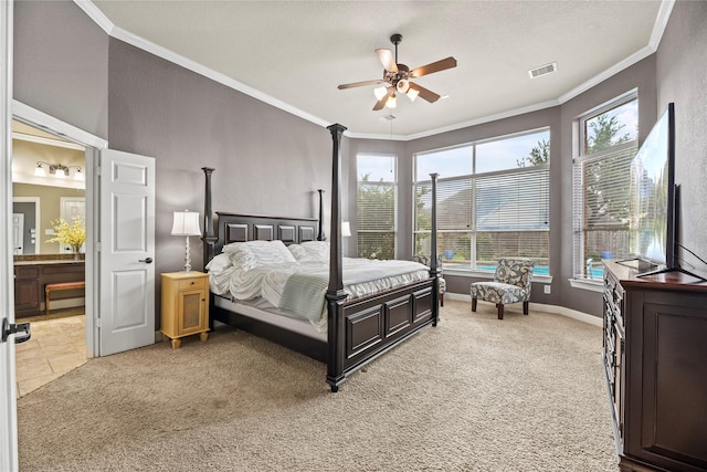12415 Bunker Cove Dr, Cypress, TX 77433 - bedroom with multiple windows, ornamental molding, light carpet, and ensuite bath