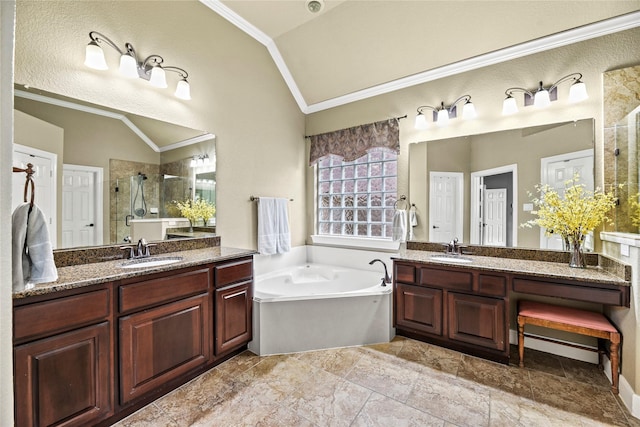 12415 Bunker Cove Dr, Cypress, TX 77433 - full bathroom with vaulted ceiling, crown molding, a shower stall, two vanities, and a garden tub