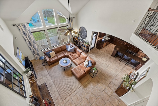 12415 Bunker Cove Dr, Cypress, TX 77433 - living room with high vaulted ceiling, ceiling fan, and baseboards