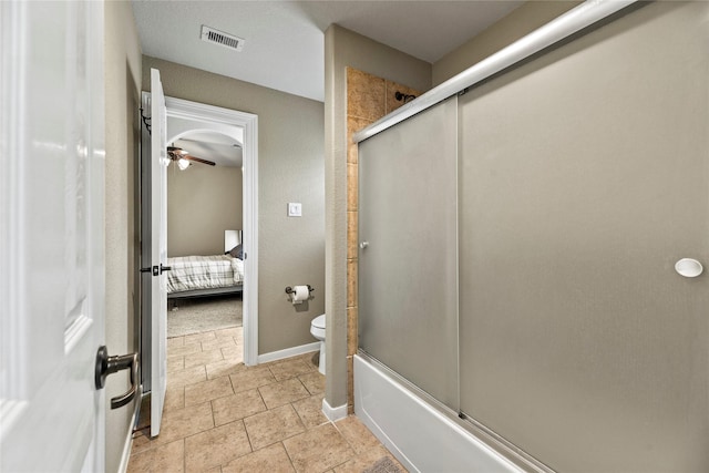 12415 Bunker Cove Dr, Cypress, TX 77433 - bathroom featuring ensuite bath, toilet, enclosed tub / shower combo, baseboards, and ceiling fan