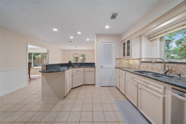 20611 Shillington Ct, Katy, TX 77450 - kitchen featuring stainless steel dishwasher, a sink, recessed lighting, a peninsula, and decorative backsplash