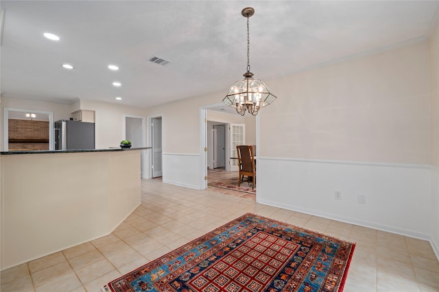 20611 Shillington Ct, Katy, TX 77450 - kitchen featuring freestanding refrigerator, a chandelier, dark countertops, recessed lighting, and decorative light fixtures