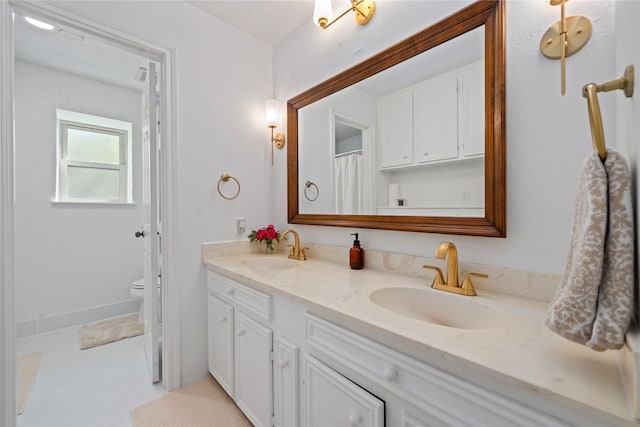 20611 Shillington Ct, Katy, TX 77450 - full bathroom featuring double vanity, toilet, and tile patterned floors