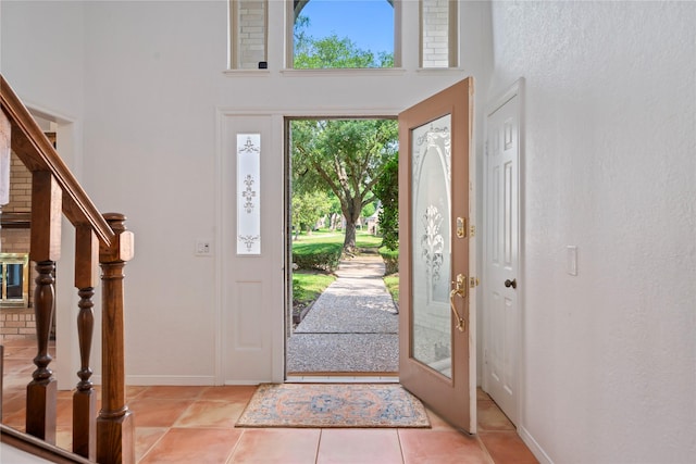 20611 Shillington Ct, Katy, TX 77450 - foyer featuring a high ceiling, stairway, baseboards, and light tile patterned floors
