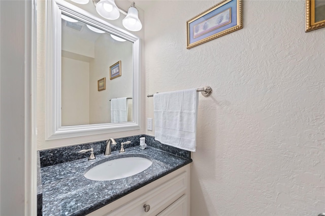 20611 Shillington Ct, Katy, TX 77450 - bathroom featuring vanity and a textured wall