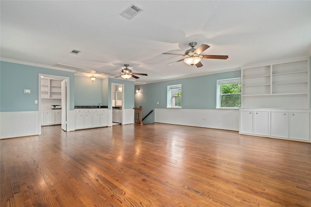 20611 Shillington Ct, Katy, TX 77450 - unfurnished room with a wainscoted wall, wood finished floors, a ceiling fan, and ornamental molding