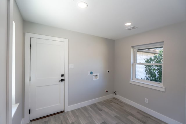 9219 Pecos St, Houston, TX 77055 - laundry room featuring hookup for an electric dryer, gas dryer hookup, light wood finished floors, baseboards, and hookup for a washing machine