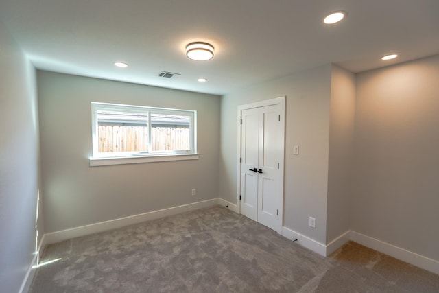 9219 Pecos St, Houston, TX 77055 - unfurnished bedroom with carpet floors, baseboards, recessed lighting, and a closet