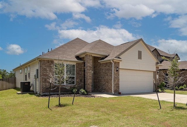 5766 Cerrillos Dr, Bryan, TX 77807 - french provincial home with concrete driveway, central AC, brick siding, and an attached garage