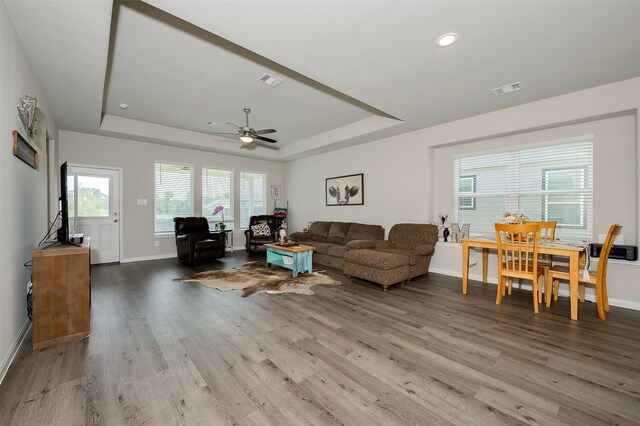 5766 Cerrillos Dr, Bryan, TX 77807 - living room with a tray ceiling, wood finished floors, baseboards, a ceiling fan, and recessed lighting