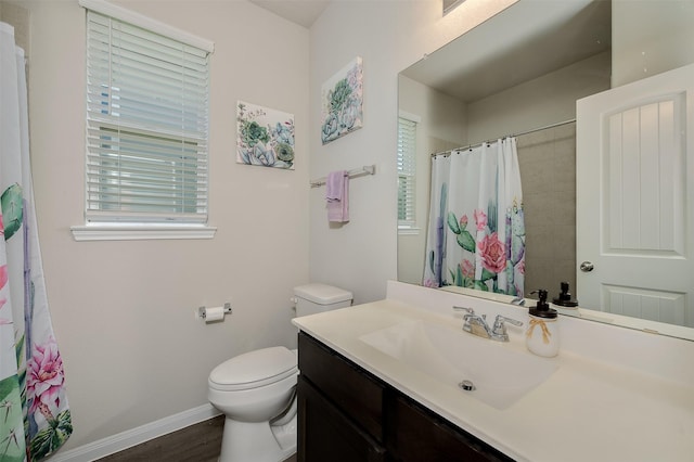 5766 Cerrillos Dr, Bryan, TX 77807 - full bathroom featuring vanity, baseboards, toilet, and plenty of natural light