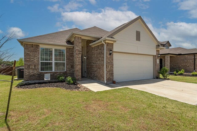 5766 Cerrillos Dr, Bryan, TX 77807 - view of front of house featuring driveway, brick siding, a front yard, an attached garage, and cooling unit