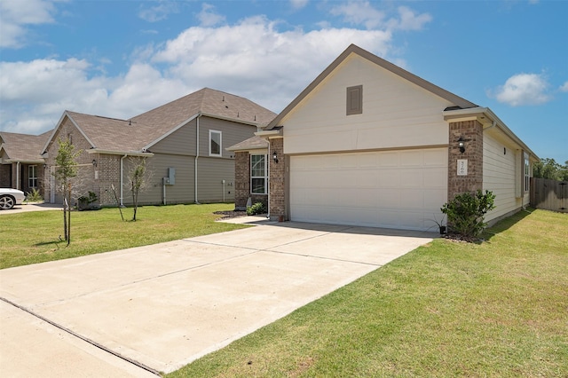 5766 Cerrillos Dr, Bryan, TX 77807 - view of front of house featuring brick siding, driveway, and a front yard