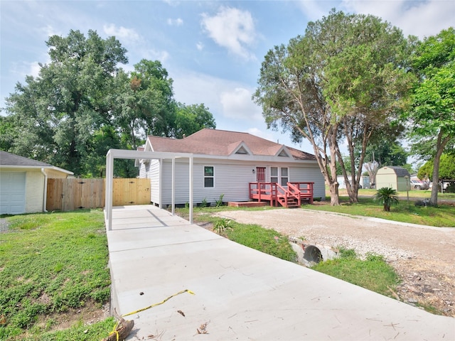2703 Areba St, Houston, TX 77091 - view of front of home featuring driveway, a deck, a gate, and a carport