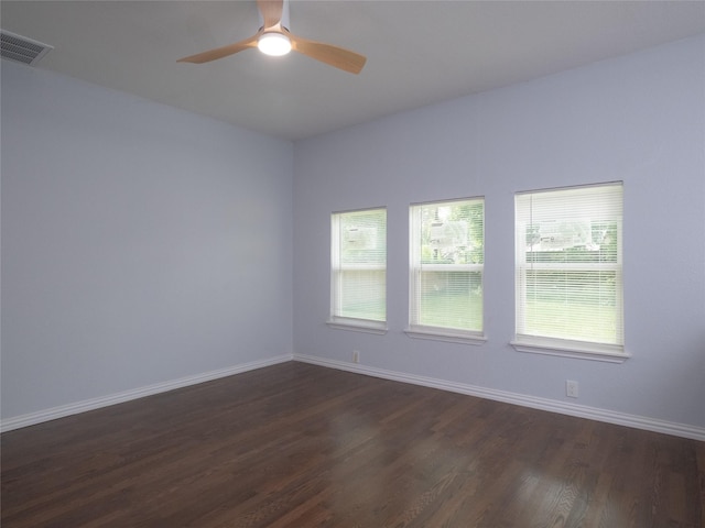 2703 Areba St, Houston, TX 77091 - unfurnished room featuring dark wood finished floors, baseboards, and ceiling fan