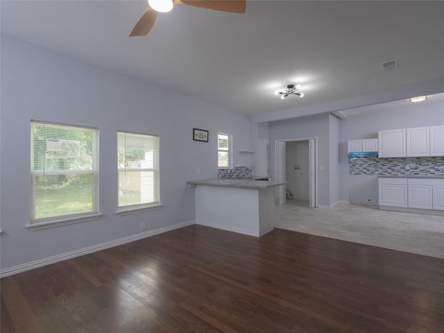 2703 Areba St, Houston, TX 77091 - unfurnished living room featuring a ceiling fan, light wood finished floors, and baseboards