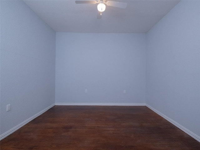 2703 Areba St, Houston, TX 77091 - spare room featuring a ceiling fan, dark wood-style floors, and baseboards