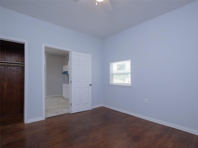 2703 Areba St, Houston, TX 77091 - unfurnished bedroom featuring wood finished floors, baseboards, a ceiling fan, and a closet