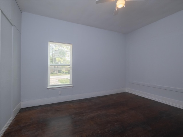 2703 Areba St, Houston, TX 77091 - unfurnished room featuring dark wood-type flooring, ceiling fan, and baseboards