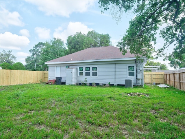 2703 Areba St, Houston, TX 77091 - rear view of property with central AC unit and roof with shingles