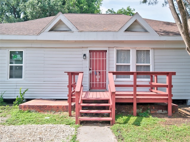 2703 Areba St, Houston, TX 77091 - view of front of house with a shingled roof and a deck