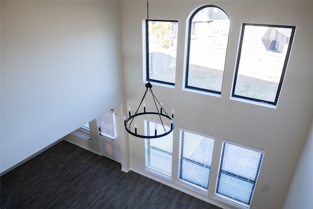 40575 Goldeneye Pl, Magnolia, TX 77354 - detailed view of wood finished floors, a chandelier, and baseboards
