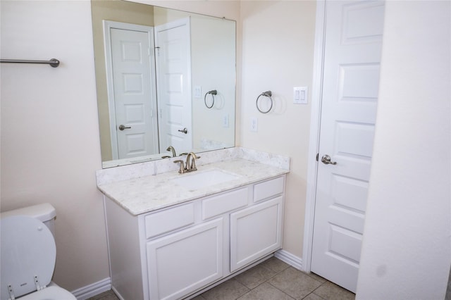 40575 Goldeneye Pl, Magnolia, TX 77354 - half bathroom featuring vanity, tile patterned flooring, toilet, and baseboards