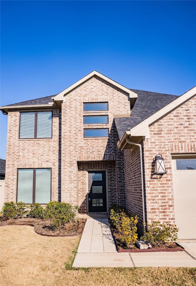 40575 Goldeneye Pl, Magnolia, TX 77354 - view of front of property featuring brick siding, a garage, and a shingled roof