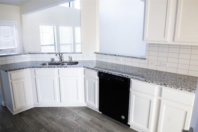 40575 Goldeneye Pl, Magnolia, TX 77354 - kitchen featuring a sink, black dishwasher, white cabinetry, and light stone countertops