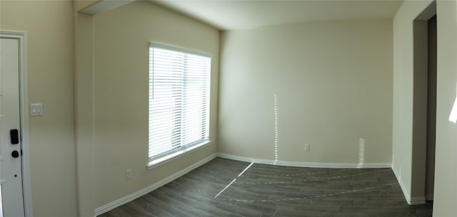 40575 Goldeneye Pl, Magnolia, TX 77354 - empty room featuring healthy amount of natural light, wood finished floors, and baseboards