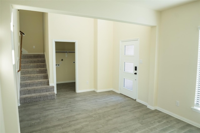 40575 Goldeneye Pl, Magnolia, TX 77354 - foyer entrance featuring stairs, wood finished floors, baseboards, and healthy amount of natural light
