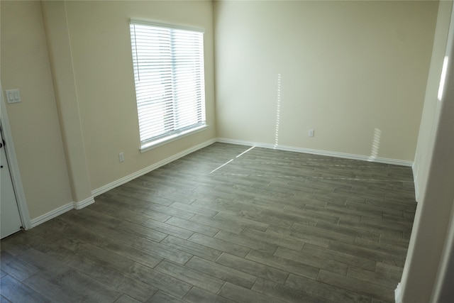 40575 Goldeneye Pl, Magnolia, TX 77354 - spare room with dark wood-type flooring, healthy amount of natural light, and baseboards