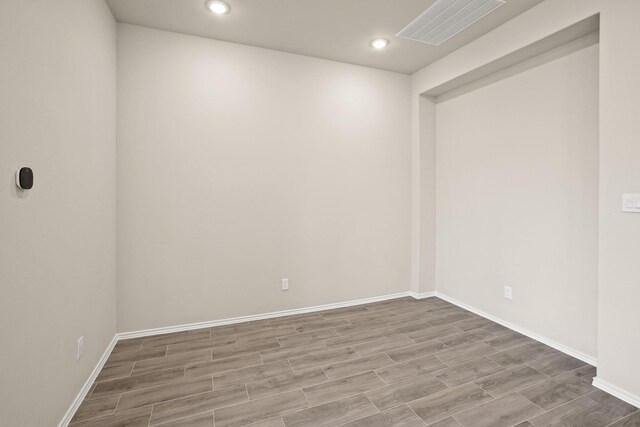 1963 Waters Branch Dr, Missouri City, TX 77459 - unfurnished room featuring wood finished floors, baseboards, and recessed lighting