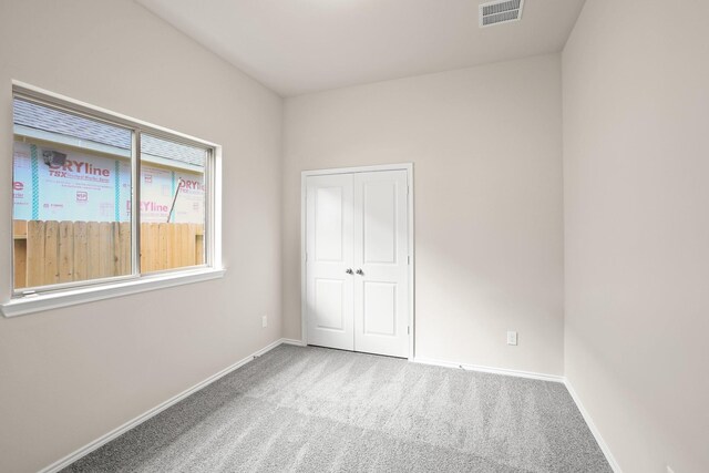 1963 Waters Branch Dr, Missouri City, TX 77459 - unfurnished bedroom featuring carpet flooring, baseboards, and a closet