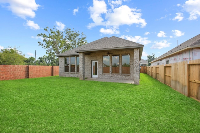 1963 Waters Branch Dr, Missouri City, TX 77459 - rear view of house with roof with shingles, brick siding, and ceiling fan