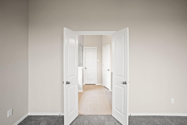 1963 Waters Branch Dr, Missouri City, TX 77459 - tiled empty room featuring baseboards and carpet flooring