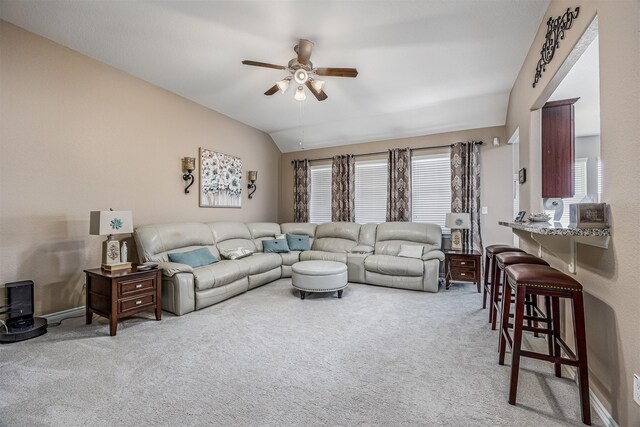 8406 Quiet Bay Dr, Baytown, TX 77523 - carpeted living room with ceiling fan, lofted ceiling, and baseboards