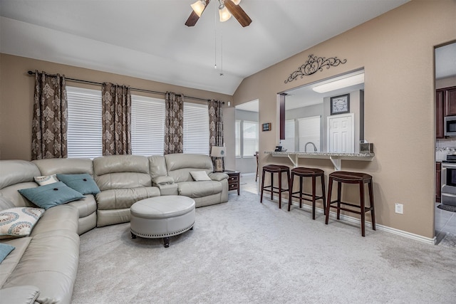 8406 Quiet Bay Dr, Baytown, TX 77523 - living area with light colored carpet, lofted ceiling, a ceiling fan, and baseboards