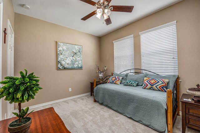 8406 Quiet Bay Dr, Baytown, TX 77523 - carpeted bedroom featuring baseboards and a ceiling fan