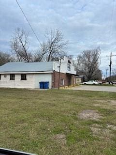 9085 Main St, Batson, TX 77519 - view of property exterior featuring a yard