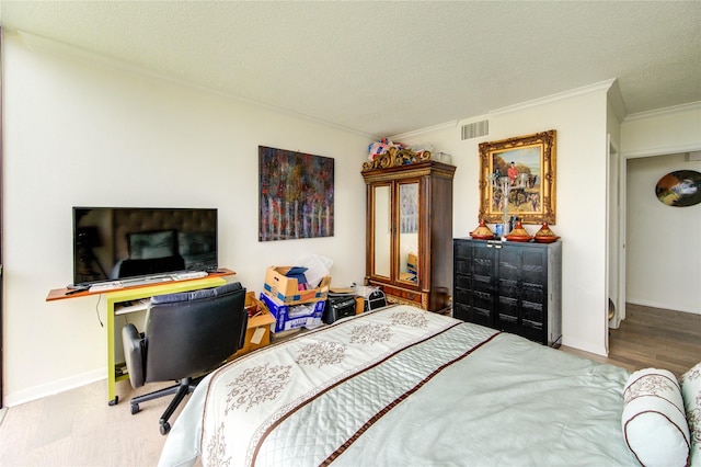 5001 Woodway Dr Unit 1405, Houston, TX 77056 - bedroom featuring ornamental molding, a textured ceiling, baseboards, and a desk