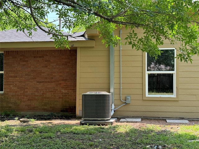 8117 Snowden St, Houston, TX 77028 - view of side of property with central air condition unit and brick siding