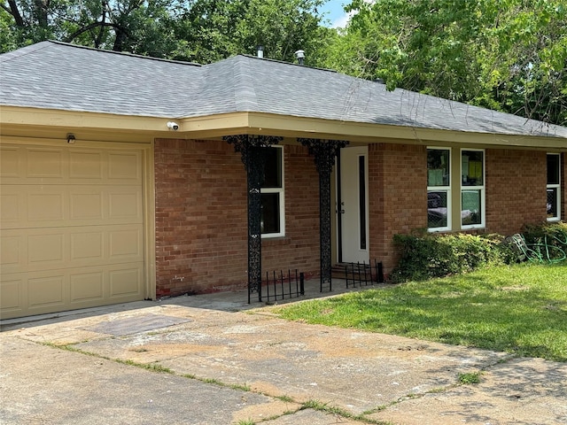 8117 Snowden St, Houston, TX 77028 - single story home featuring an attached garage, brick siding, concrete driveway, and a shingled roof