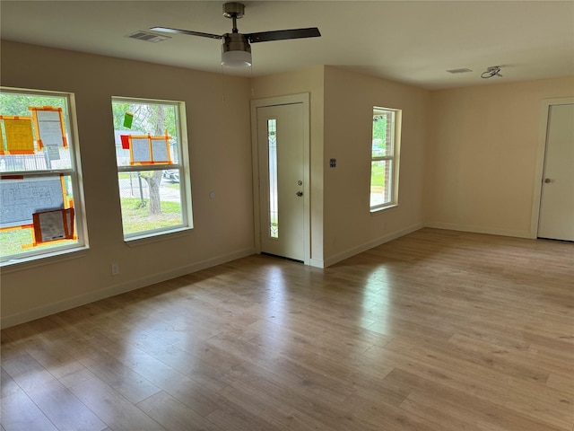 8117 Snowden St, Houston, TX 77028 - foyer featuring ceiling fan, baseboards, and light wood finished floors