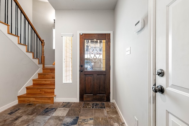 1333 W 21st St Unit B, Houston, TX 77008 - foyer entrance featuring stone finish flooring, baseboards, and stairs