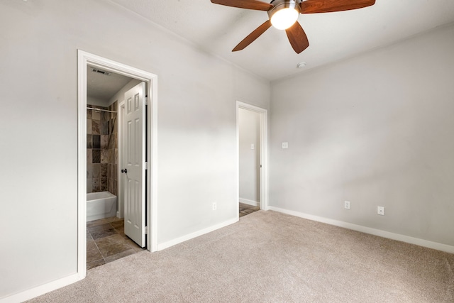 1333 W 21st St Unit B, Houston, TX 77008 - unfurnished bedroom with carpet flooring, baseboards, connected bathroom, and ceiling fan