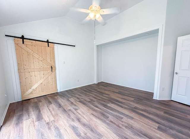 7331 Burkridge Dr, Houston, TX 77041 - unfurnished bedroom featuring wood finished floors, a barn door, vaulted ceiling, baseboards, and a ceiling fan