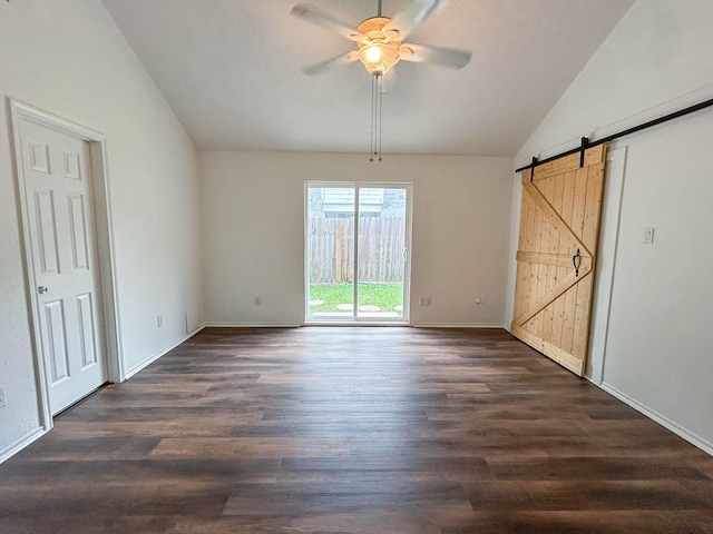 7331 Burkridge Dr, Houston, TX 77041 - unfurnished bedroom with lofted ceiling, access to exterior, a barn door, dark wood finished floors, and baseboards