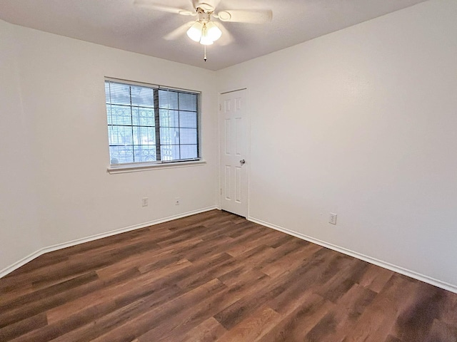 7331 Burkridge Dr, Houston, TX 77041 - spare room with dark wood finished floors, baseboards, and ceiling fan