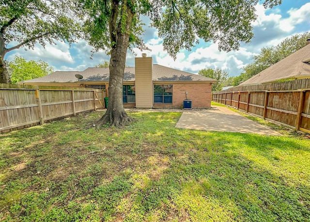 7331 Burkridge Dr, Houston, TX 77041 - rear view of house with a patio area, a chimney, and brick siding